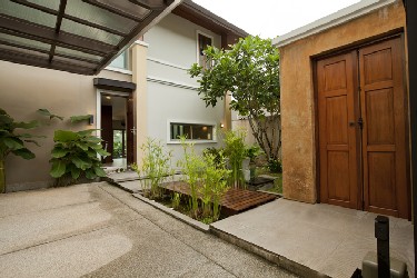 Front Garden with Fishpond, Welcome Gate and Carport